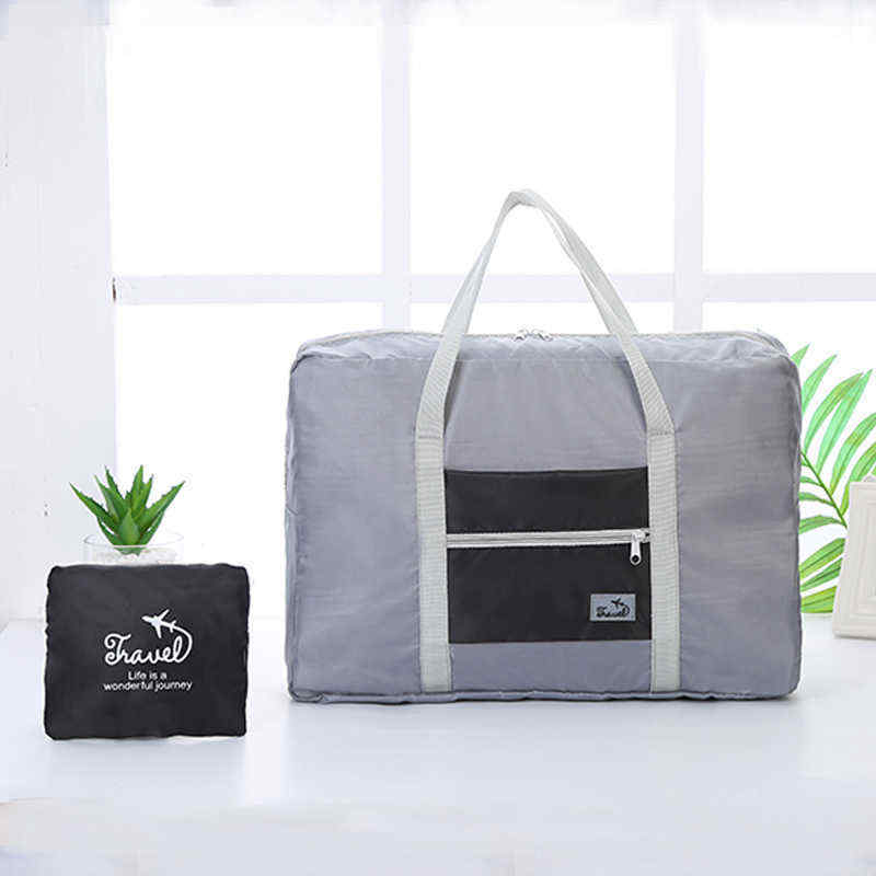 Korean-version-of-the-portable-clothing-luggage-bag-travel-storage-bag-waterproof-large-capacity-air-1454641